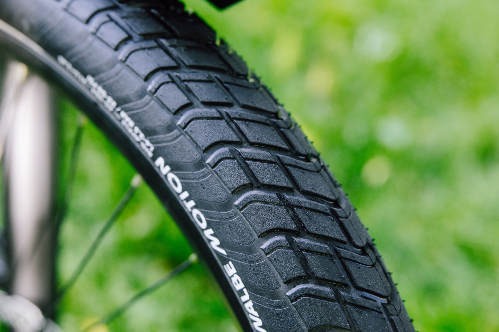 Schwalbe Pneu Motion Big Apple 28x2.35 Addix Green starr mit Reflexstreifen black